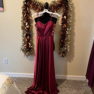 Juniors Burgundy gown with sheer nude mesh on the sides.